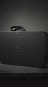 close-up video of skull design on leather train case for storage and travel